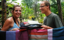 Stephen and Meike with a selection of silk scarves from Laos