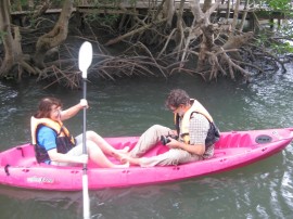 Kayaking through the mangroves - Bronwen paddling and Fred filming